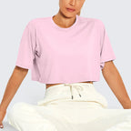 White Y2K Harajuku crop top by FitiqueFit, casualwear style, shown on a model with a relaxed fit and trendy design.