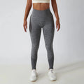 Seamless ribbed yoga leggings from FitiqueFit with tummy control, designed for activewear and comfortable movement.