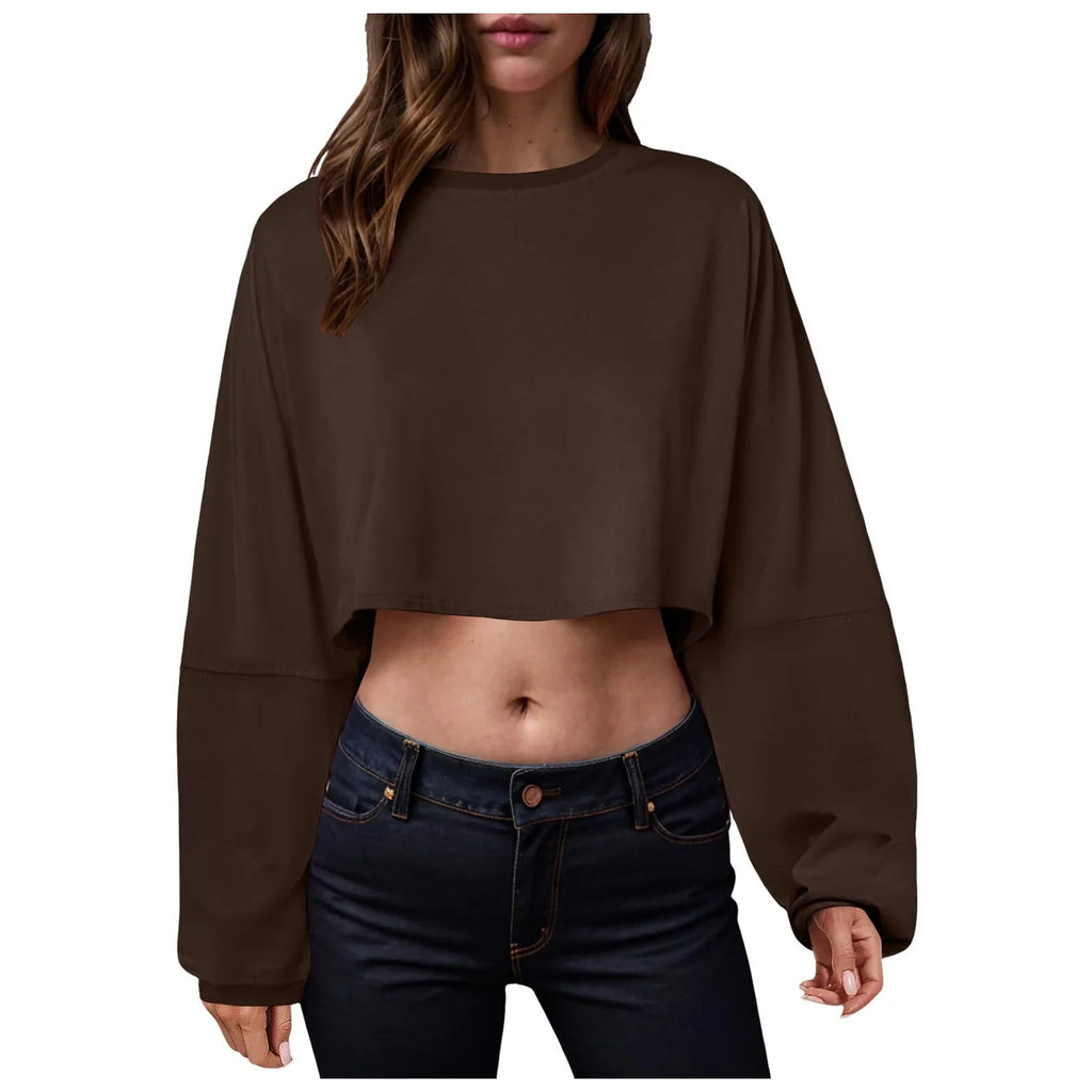 Women’s long sleeve loose-fit crop top in casualwear style, from Plush Fashion Hub, shown in a relaxed fit with a comfortable design.