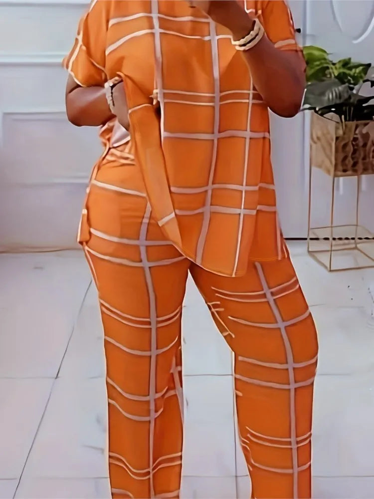 Plus size women’s striped grid printed casual two-piece outfit with round neck top and matching pants by Plush Fashion Hub.