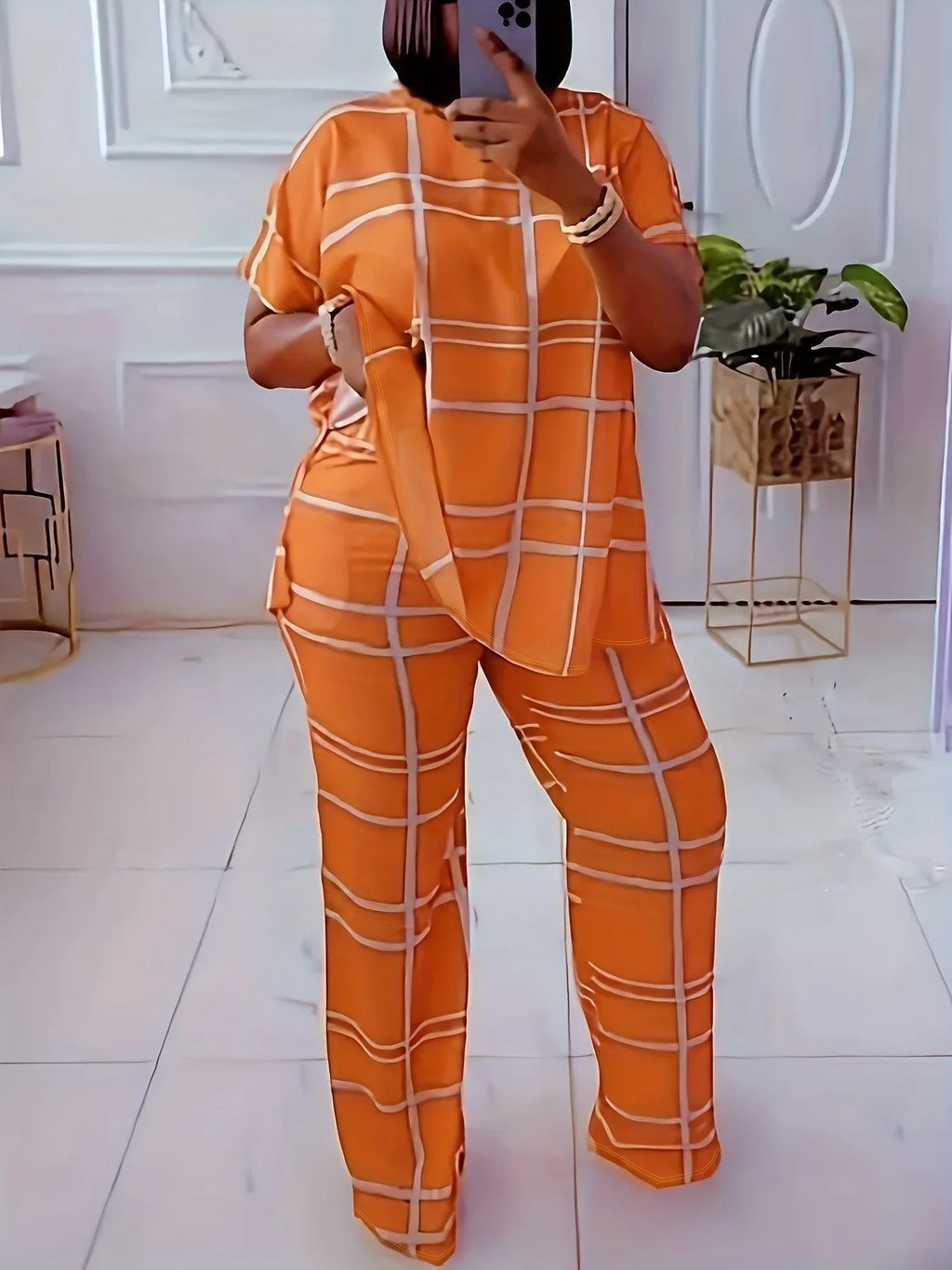 Plus size women’s casual two-piece set with striped grid print and round neck from Plush Fashion Hub, featuring a stylish and comfortable design.