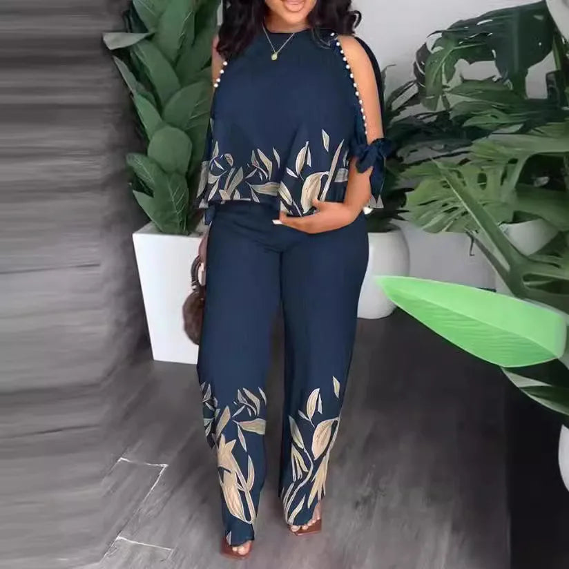 Plus size women’s short sleeve two-piece fashion outfit set by Plush Fashion Hub, featuring a stylish top and matching shorts.