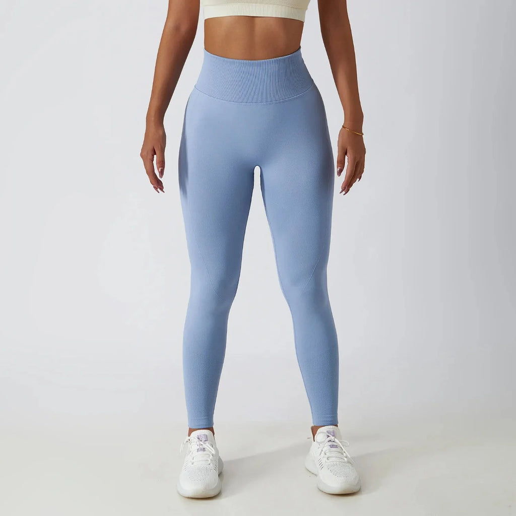 Seamless ribbed yoga leggings by FitiqueFit featuring tummy control fit, made for comfortable activewear and flexible movement.