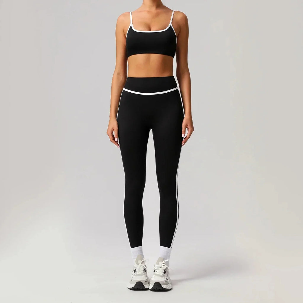 Black seamless yoga set by Plush Fashion Hub featuring high waist and hip-lifting design, ideal for activewear workouts.