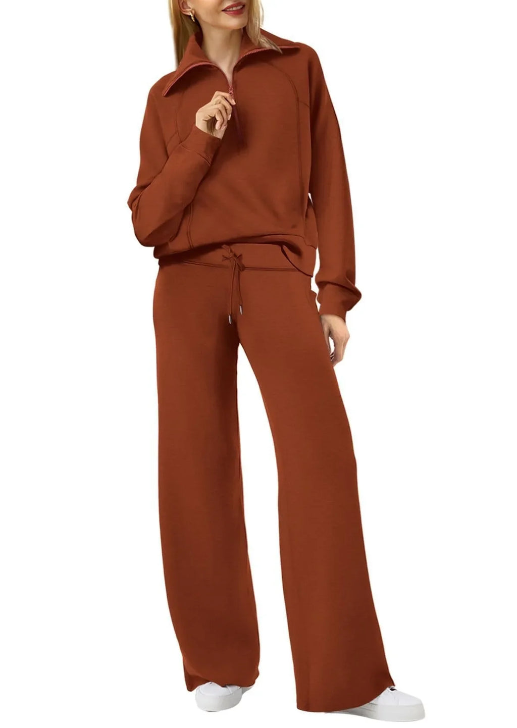 Women two-piece sweatshirt and wide-leg pants set by Plush Fashion Hub, featuring cozy fabric and stylish casual wear.