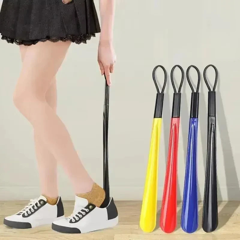Extra long flexible plastic shoe horn for women, designed to assist pregnant women in easily slipping into shoes.