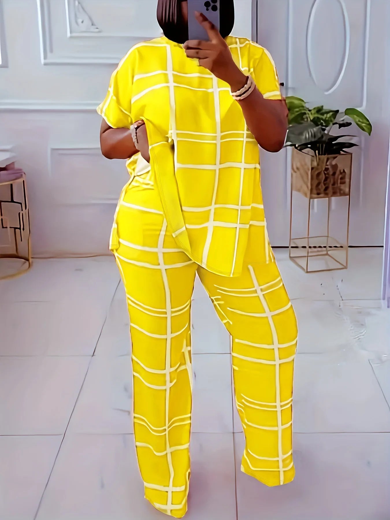Plus size women's two-piece casual outfit with striped grid print, round neck top and matching pants by Plush Fashion Hub.