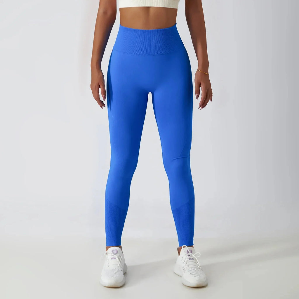 Seamless ribbed FitiqueFit yoga leggings with tummy control, featuring a stretchy, form-fitting activewear design for comfort and support.