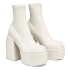 Women’s black leather short boots with square toes, zipper closure, thick soles, and high heels from Plush Fashion Hub.