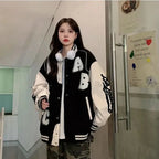 Y2K oversized lamb-wool bomber jacket for women, streetwear style, with a plush, cozy fit in neutral tones.
