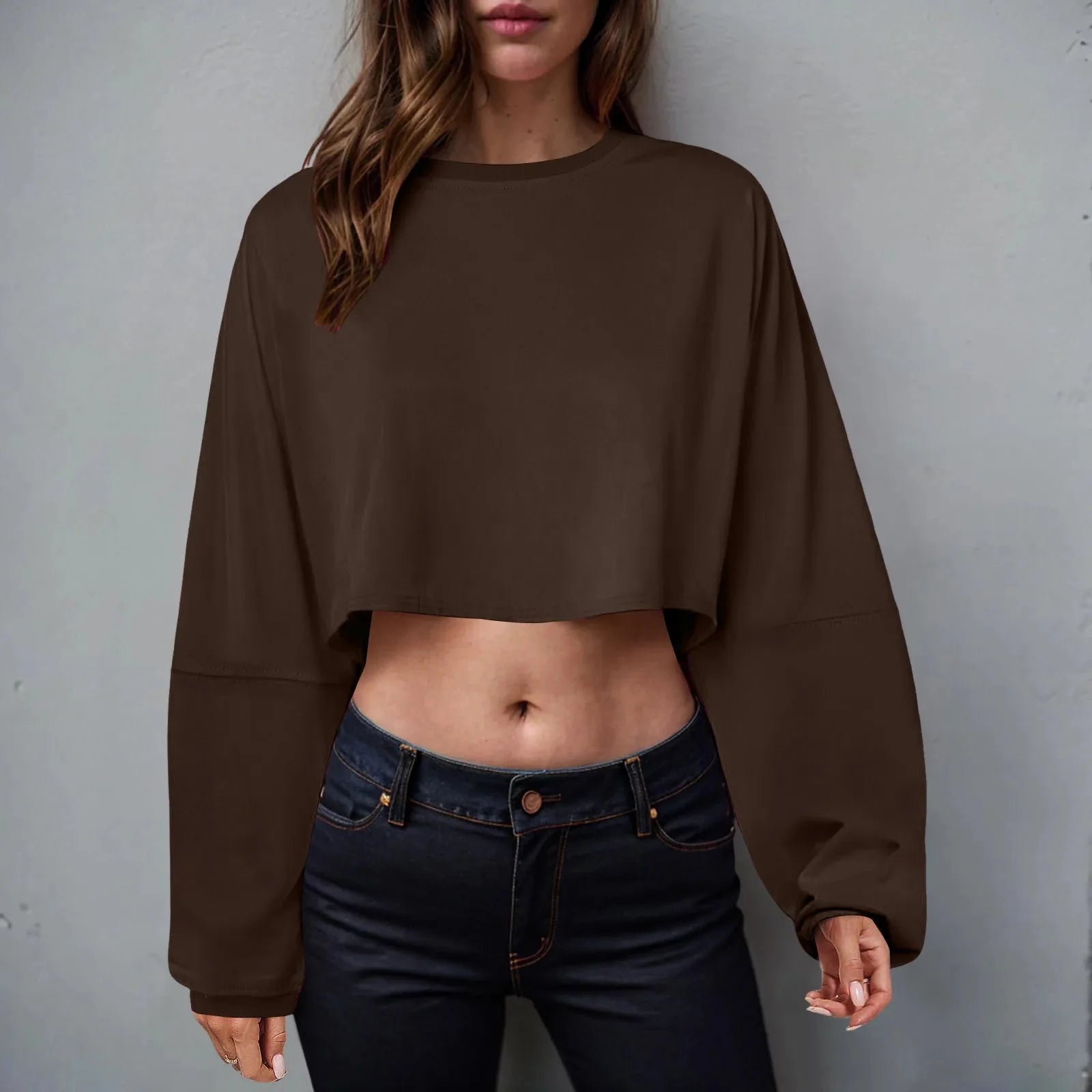 Women’s long sleeve loose-fit crop top in casualwear style from Plush Fashion Hub, shown on a model with a relaxed fit.