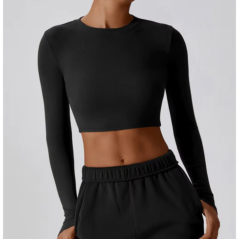 Women’s slim fit long sleeve yoga top by Plush Fashion Hub, made of stretchy activewear fabric for comfortable movement.