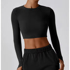 Women’s slim fit long sleeve yoga top by Plush Fashion Hub, made of stretchy activewear fabric for comfortable movement.