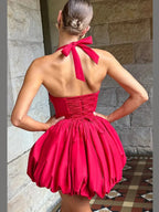 Pink women’s corset mini dress with puffball hem, casualwear by FitiqueFit, shown on a model with a stylish, relaxed pose.