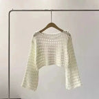Women’s crochet knit beach cover-up from Plush Fashion Hub, showcasing lightweight casualwear with intricate crochet details.
