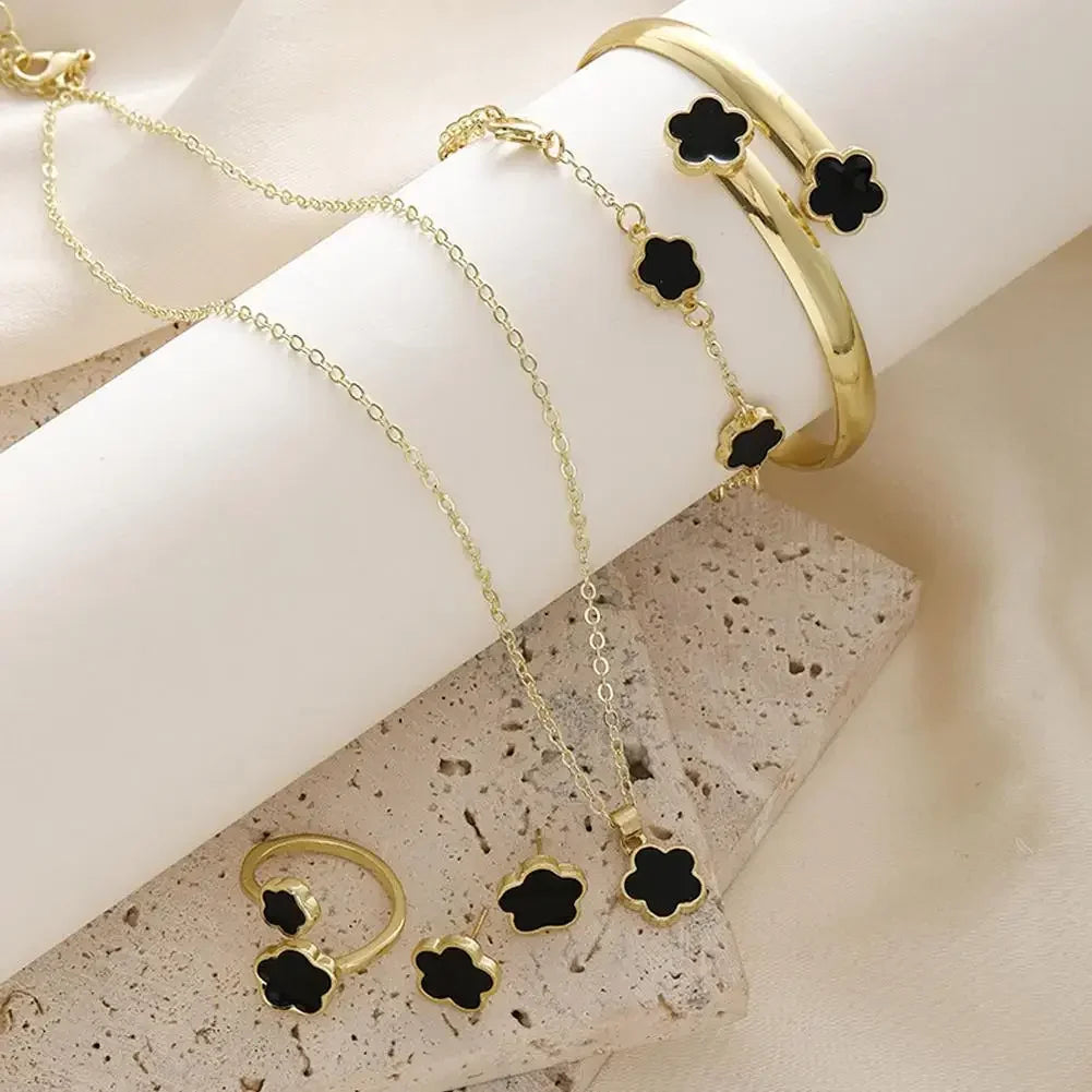 Plum Blossom Plant five-leaf necklace and earring set by Plush Fashion Hub, featuring delicate floral jewelry with five leaf designs.