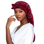 Plush Fashion Hub satin women's sleeping bonnet with long tail braid hair cover, ideal for sleep, shower, and sauna use.