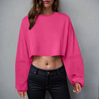 Women’s long sleeve loose-fit crop top by Plush Fashion Hub, casualwear, shown in a relaxed fit, soft fabric, and stylish design.