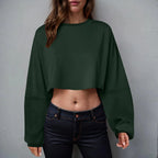 Loose-fit women's long sleeve crop top in casualwear style by Plush Fashion Hub, shown in a soft, comfortable fabric.