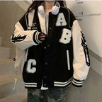 Oversized Y2K lamb-wool bomber jacket for women, streetwear style, featuring a cozy, plush wool texture and relaxed fit.
