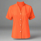 Light pink satin V-neck short sleeve shirt for women, casualwear from Plush Fashion Hub featuring an elegant, relaxed fit.