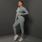 Women's seamless long sleeve yoga top from Plush Fashion Hub, shown in black, fitted and stretchy activewear for exercise or casual wear.