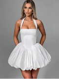 Women’s pink corset puffball-hem mini dress by FitiqueFit, featuring a fitted corset bodice and a playful puffball hem.