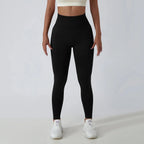 Black seamless ribbed yoga leggings with tummy control fit from FitiqueFit, designed for activewear and comfortable movement.