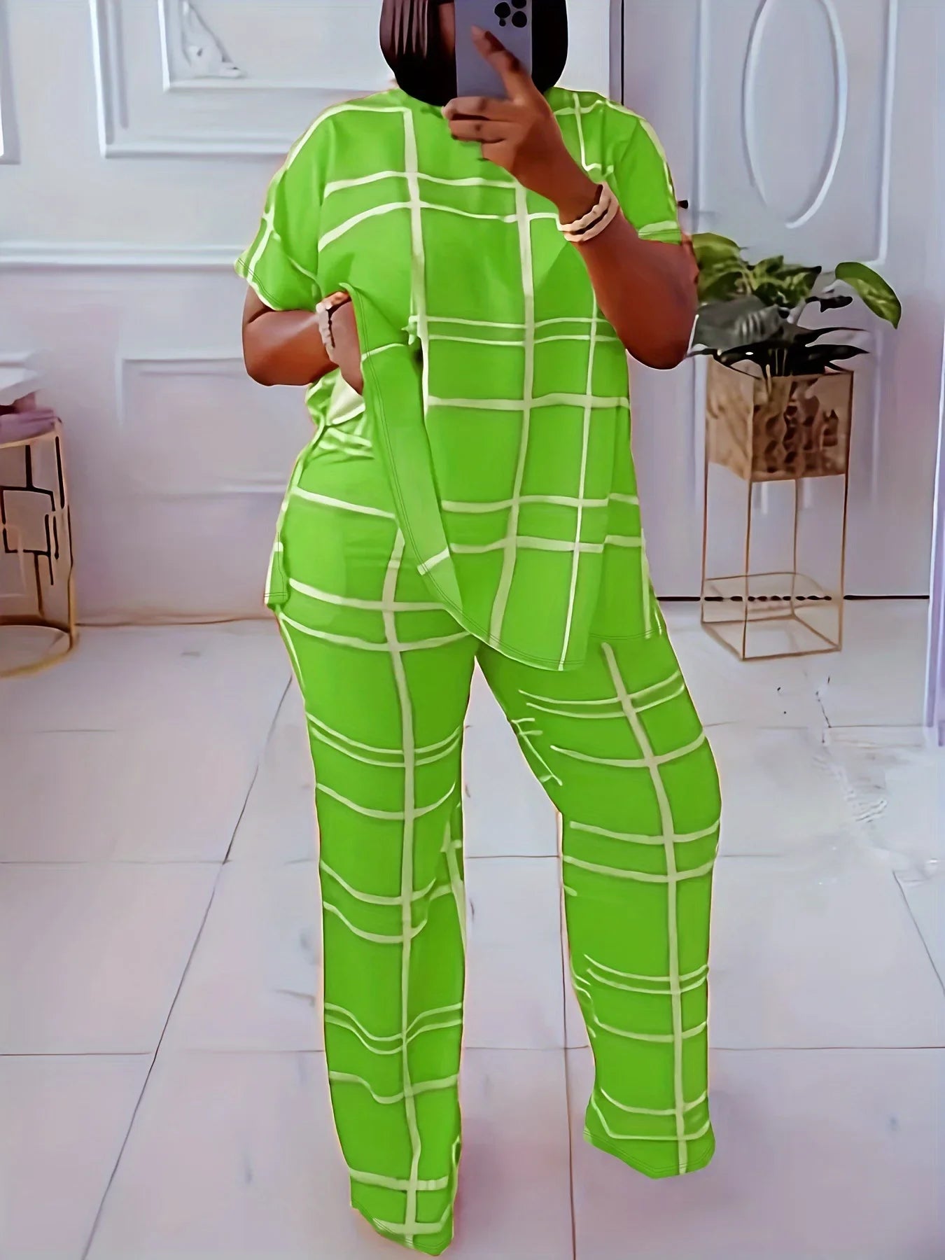 Plus size women's casual two-piece set by Plush Fashion Hub featuring striped grid print and round neck top.