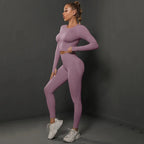 Women's seamless long sleeve yoga top from FitiqueFit, showing a fitted activewear shirt with smooth fabric and ergonomic design.