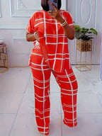 Plus size women’s casual two-piece set with striped grid print and round neck from Plush Fashion Hub, featuring a comfortable, stylish design.