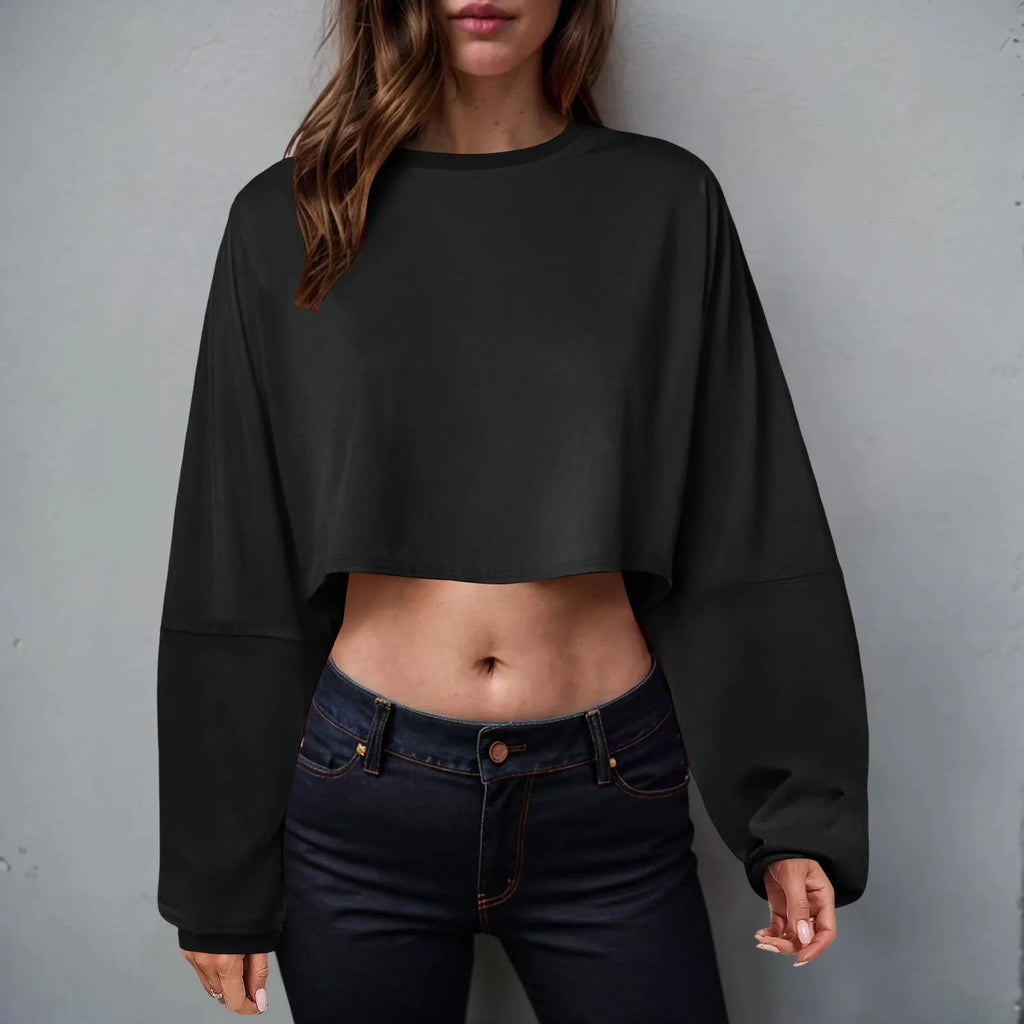 Loose-fit women's long sleeve crop top by Plush Fashion Hub, casualwear, shown in soft fabric with a relaxed, stylish fit.