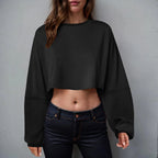 Loose-fit women's long sleeve crop top by Plush Fashion Hub, casualwear, shown in soft fabric with a relaxed, stylish fit.