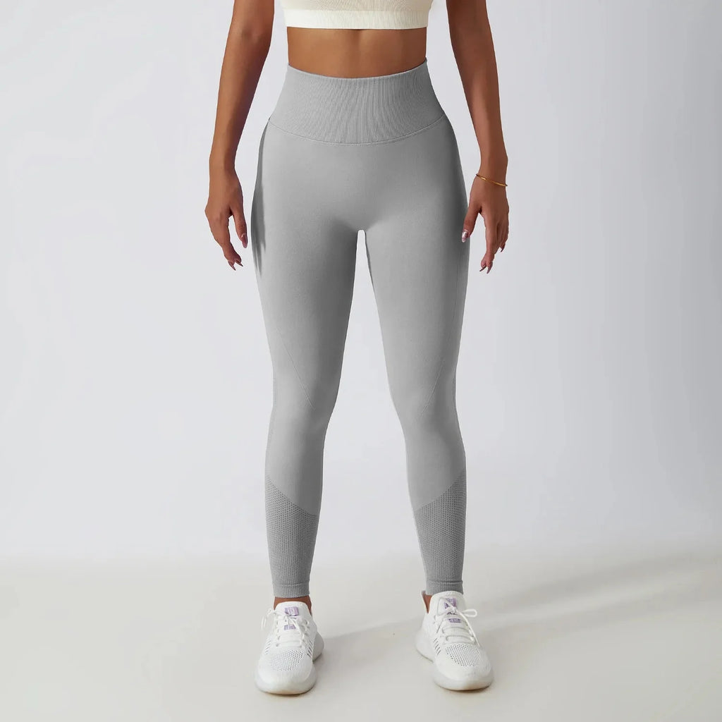 Seamless ribbed yoga leggings by FitiqueFit featuring tummy control fit, designed for activewear and comfortable movement.
