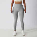 Seamless ribbed yoga leggings by FitiqueFit featuring tummy control fit, designed for activewear and comfortable movement.