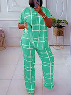 Plus size women’s Elements striped grid printed casual two-piece set with round neck, featuring a stylish, comfortable design.