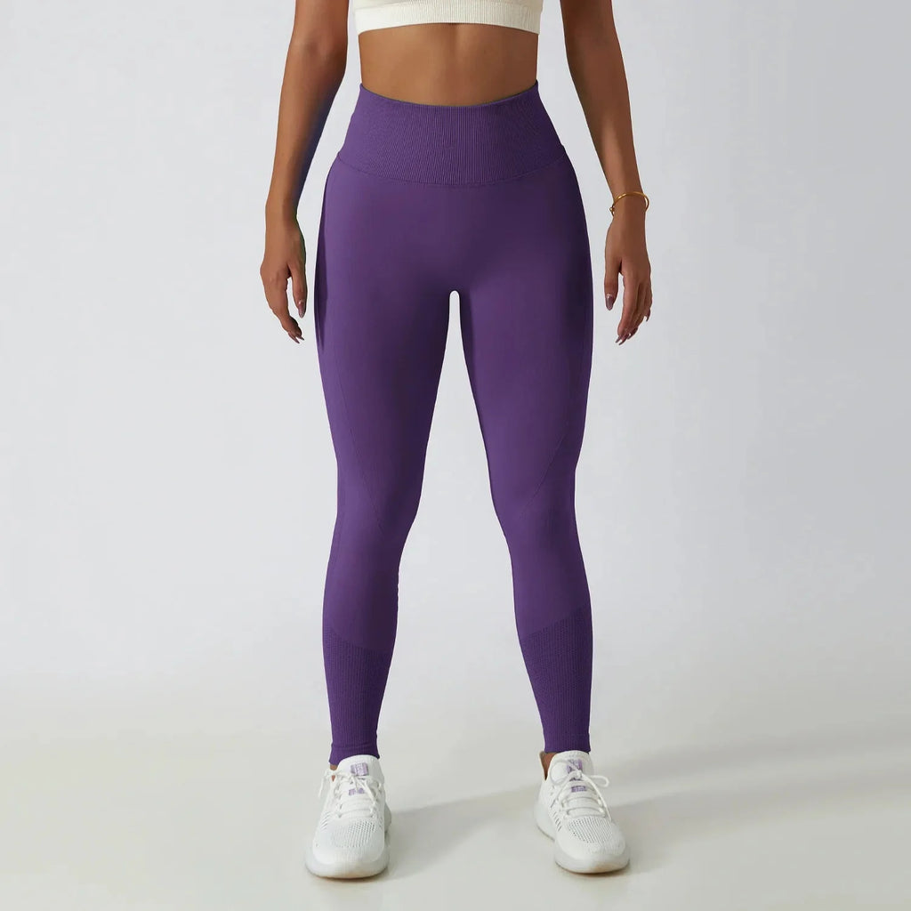 Seamless ribbed yoga leggings from FitiqueFit with tummy control fit, stretchy activewear designed for comfort and flexibility.