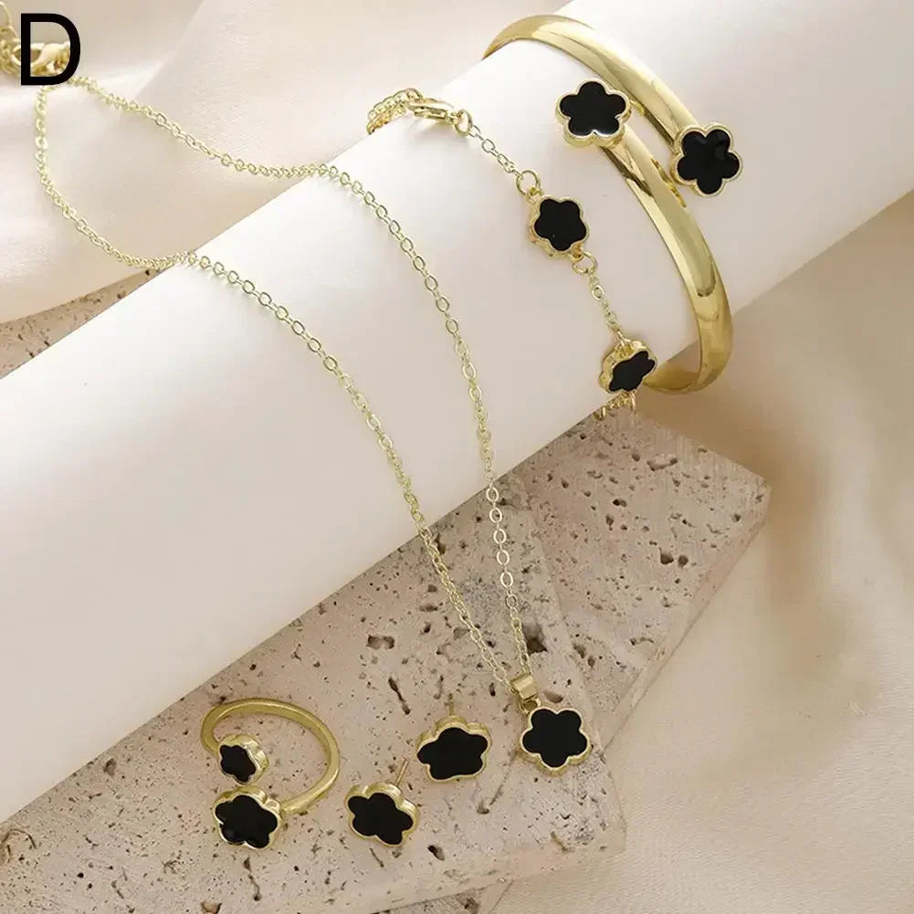 Plum Blossom Plant five-leaf necklace and earring set featuring floral jewelry from Plush Fashion Hub, displayed on a white background.