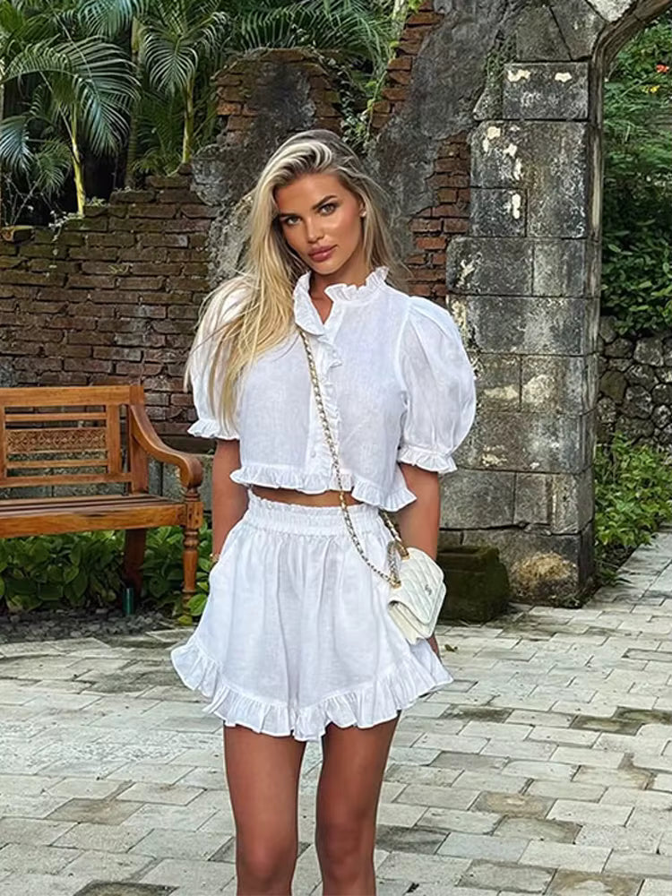 Women's ruffled linen-blend cropped blouse and shorts set by FitiqueFit, featuring lightweight fabric and stylish ruffle details.