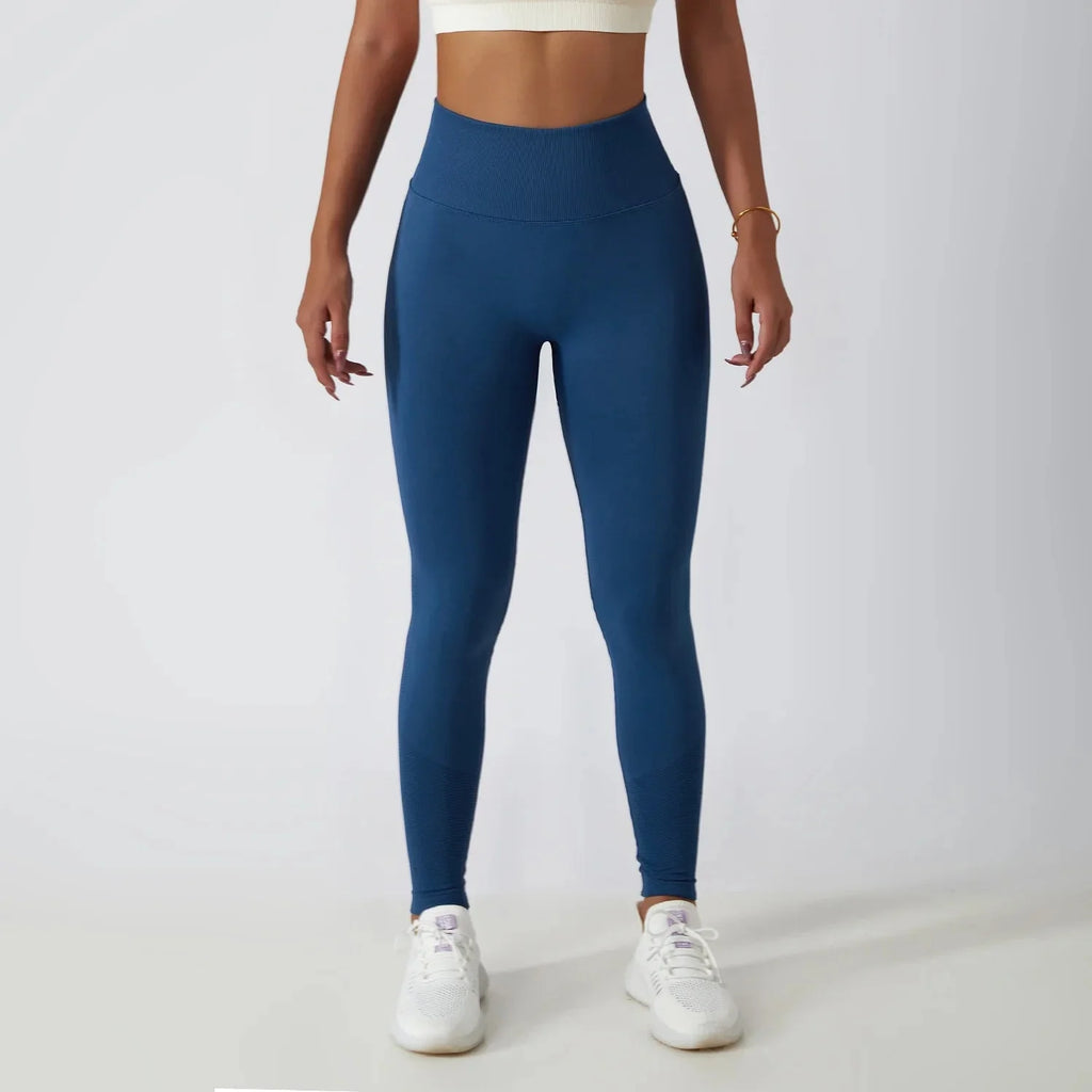 Seamless ribbed yoga leggings by FitiqueFit with tummy control fit, showcasing their stretchy, high-waisted design for activewear.