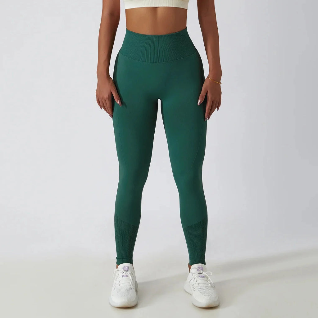 Seamless ribbed yoga leggings from FitiqueFit featuring tummy control fit, designed for activewear and comfortable movement.