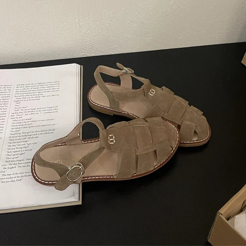 Women's Roman sandals by LadyShow.Store, 2023 summer flat leather shoes with hollowed cage design and retro style.
