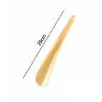 Plastic shoe horn by Plush Fashion Hub, extra long, flexible, durable, designed for pregnant women to easily assist with shoes.