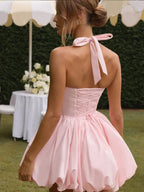 Women’s pink corset puffball-hem mini dress by FitiqueFit, showing a fitted bodice, puff sleeves, and a short flared hem.