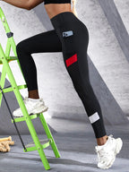 Black colorblocked mesh high-waist yoga leggings with side pockets, activewear by FitiqueFit, shown on a model.
