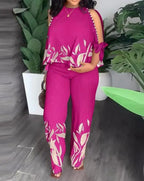 Plus size women's two-piece outfit from Plush Fashion Hub featuring a stylish short sleeve top and matching shorts.