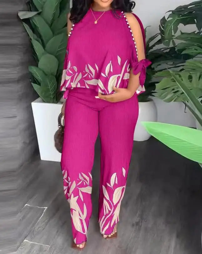 Plus size women's two-piece outfit from Plush Fashion Hub featuring a stylish short sleeve top and matching shorts.
