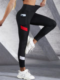 Black colorblocked mesh high-waist yoga leggings by FitiqueFit with side pockets, designed for activewear and flexible movement.