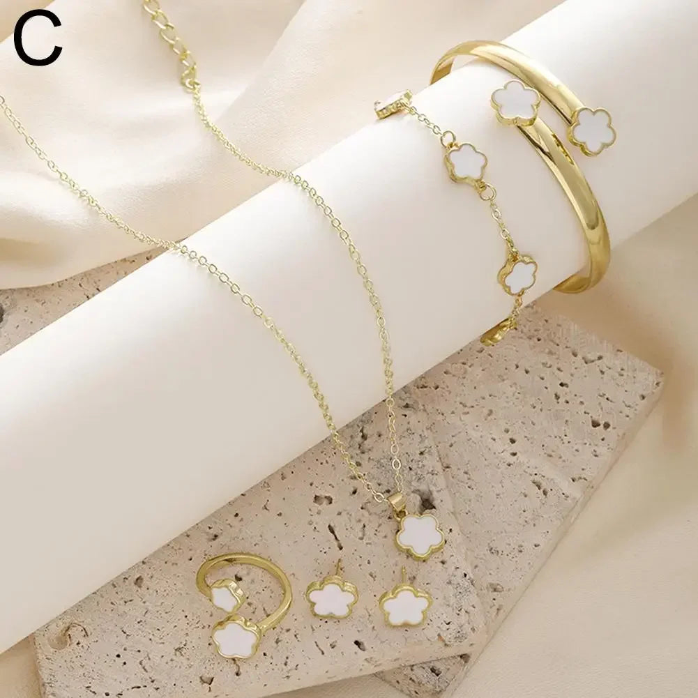 Plum Blossom Plant five leaf necklace and earring set in gold-tone jewelry, featuring floral design with five-piece set.