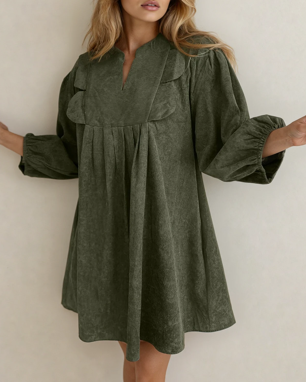 Green Micah scallop detail pleated corduroy mini dress by Indie & Co., featuring scalloped edges and a fitted, stylish design.